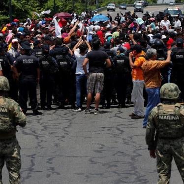 Mexican authorities stop a migrant caravan that had earlier crossed the Mexico - Guatemala border, near Metapa, Chiapas state, Mexico, Wednesday, June 5, 2019.