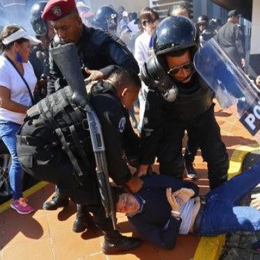 An anti-government protester is dragged away and arrested by police as security forces disrupt an opposition march coined "United for Freedom" in Managua, Nicaragua, Sunday, Oct. 14, 2018.