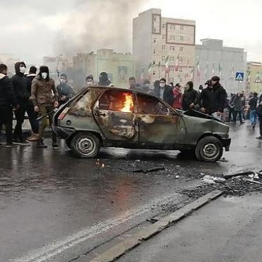 Iranian protesters gather around a burning car during a demonstration against an increase in gasoline prices in the capital Tehran, on November 16, 2019. 