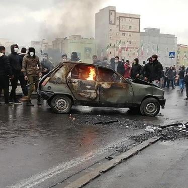 Iranian protesters gather around a burning car during a demonstration against an increase in gasoline prices in the capital Tehran, on November 16, 2019. 