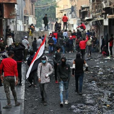 Protesters gather while security forces close River Street during ongoing anti-government protests in Baghdad, Iraq, December 10, 2019.