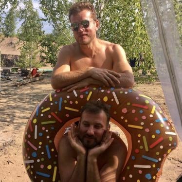  Edalov (lower) and his partner Evgeny Efimov at a picnic in June 2019, days before he was killed.