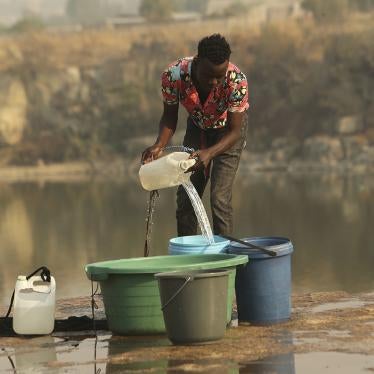 A man fetches water from a disused quarry in Harare, October 1, 2019. 
